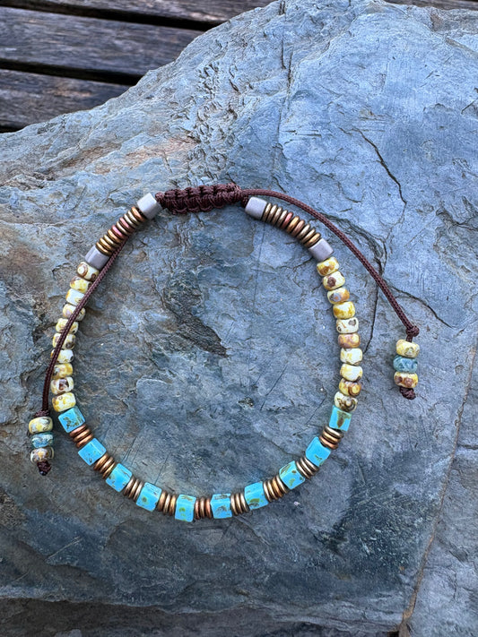 A turquoise macrame bracelet